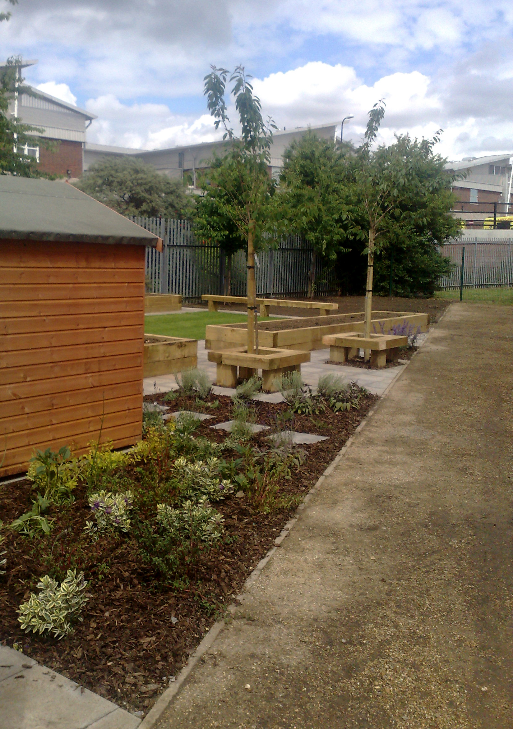 View of kitchen garden with school playgorund in background